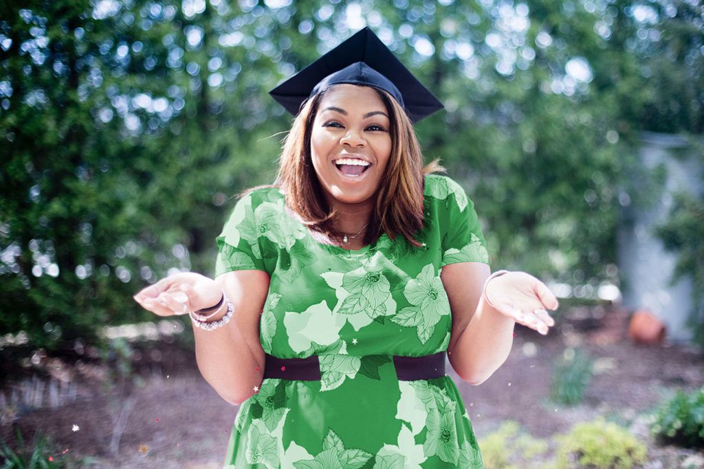 woman in graduation cap and green dress